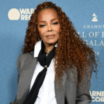 Janet Jackson performing her iconic hit Rhythm Nation during a live concert celebration of her legendary music career.