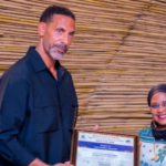 Rio Ferdinand receives Tanzania tourism ambassador certificate during official meeting in Arusha.