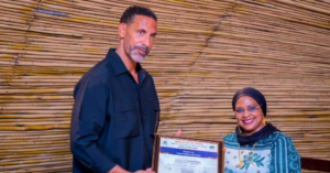 Rio Ferdinand receives Tanzania tourism ambassador certificate during official meeting in Arusha.