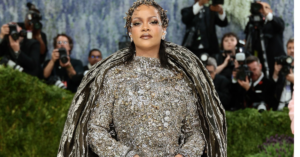 Rihanna arrives at the Met Gala 2026 wearing a custom Maison Margiela Artisanal gown embellished with crystals and antique jewels.