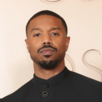 Michael B. Jordan stands beside Lonnie Ali as they introduce actor Jaalen Best, the rising star selected to portray Muhammad Ali in the highly anticipated Prime Video series The Greatest.