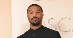 Michael B. Jordan stands beside Lonnie Ali as they introduce actor Jaalen Best, the rising star selected to portray Muhammad Ali in the highly anticipated Prime Video series The Greatest.