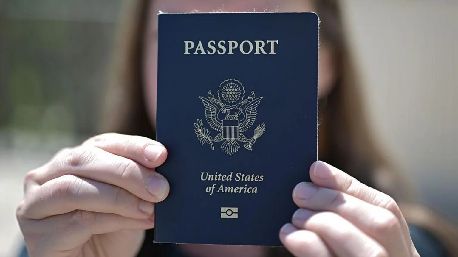 US passport beside legal papers as America cracks down on unpaid child support debt.