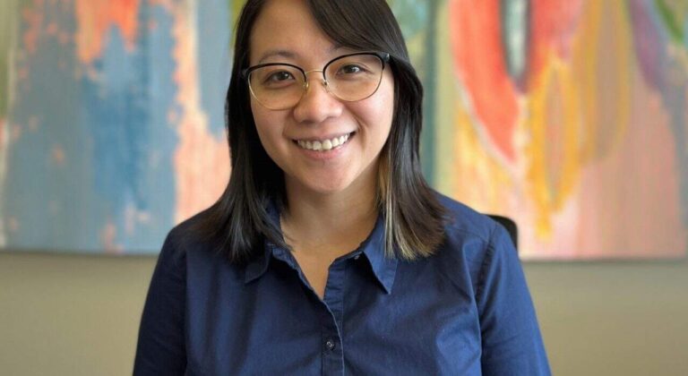 Khanh Nguyen celebrates earning her electrical engineering degree after returning to school while balancing family and work responsibilities.