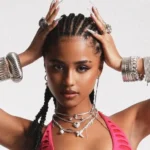 Tyla poses with her two awards after winning Best Afrobeats Artist and Social Song of the Year at the 2026 American Music Awards in Las Vegas.
