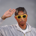 Pharrell Williams walks the runway after Louis Vuitton’s Spring Summer 2027 menswear show beneath a giant surfing wave during Paris Fashion Week.