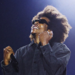 Jay-Z performing live at Roots Picnic 2026 in Philadelphia with The Roots on stage during headline set