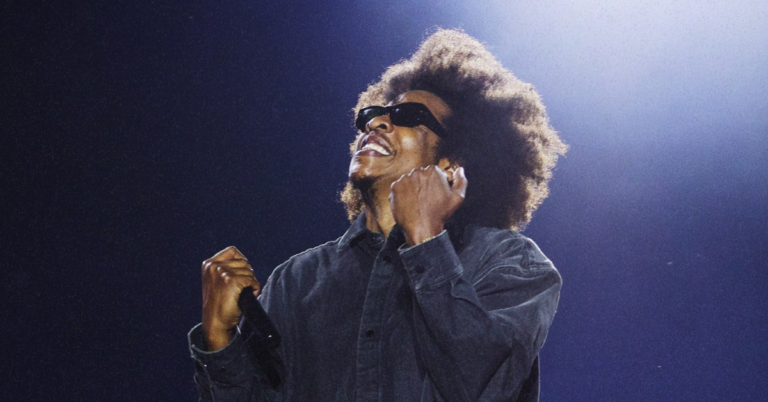 Jay-Z performing live at Roots Picnic 2026 in Philadelphia with The Roots on stage during headline set