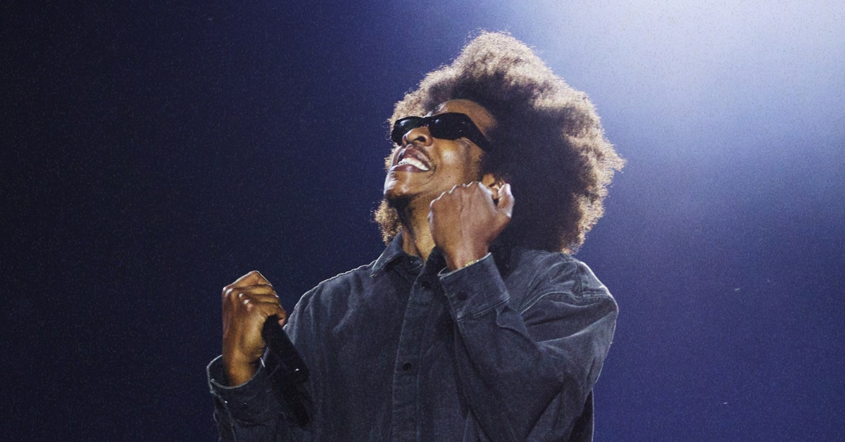 Jay-Z performing live at Roots Picnic 2026 in Philadelphia with The Roots on stage during headline set