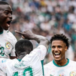 African football players celebrating historic World Cup success as African nations dominate the FIFA World Cup knockout stages.
