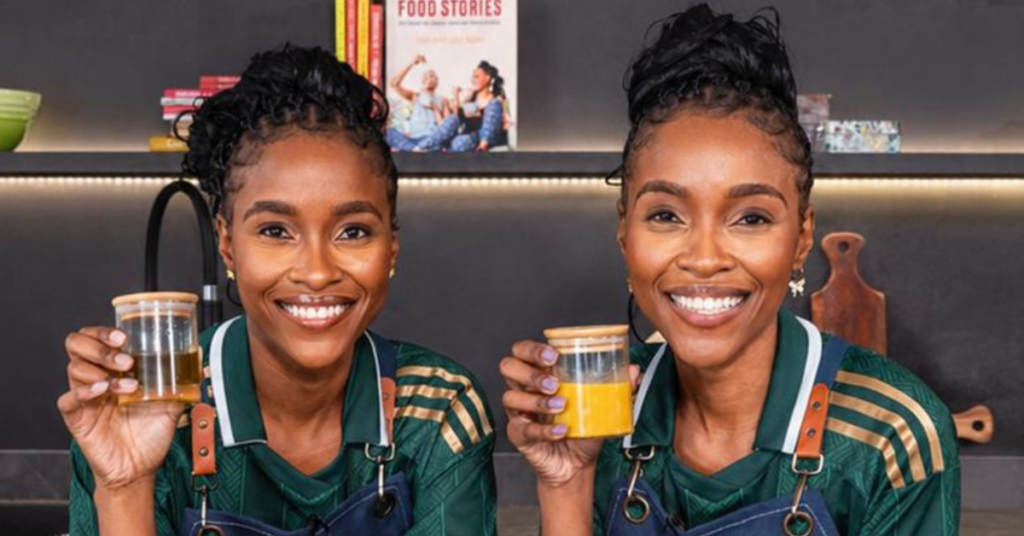 Lebo and Tebo Ndala posing in a modern kitchen during the launch of Twice as Nice – With Love From The Twins on The Home Channel.