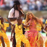 The Ghetto Kids perform with Shakira and Burna Boy during the FIFA World Cup final halftime show before a global audience.