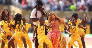 The Ghetto Kids perform with Shakira and Burna Boy during the FIFA World Cup final halftime show before a global audience.